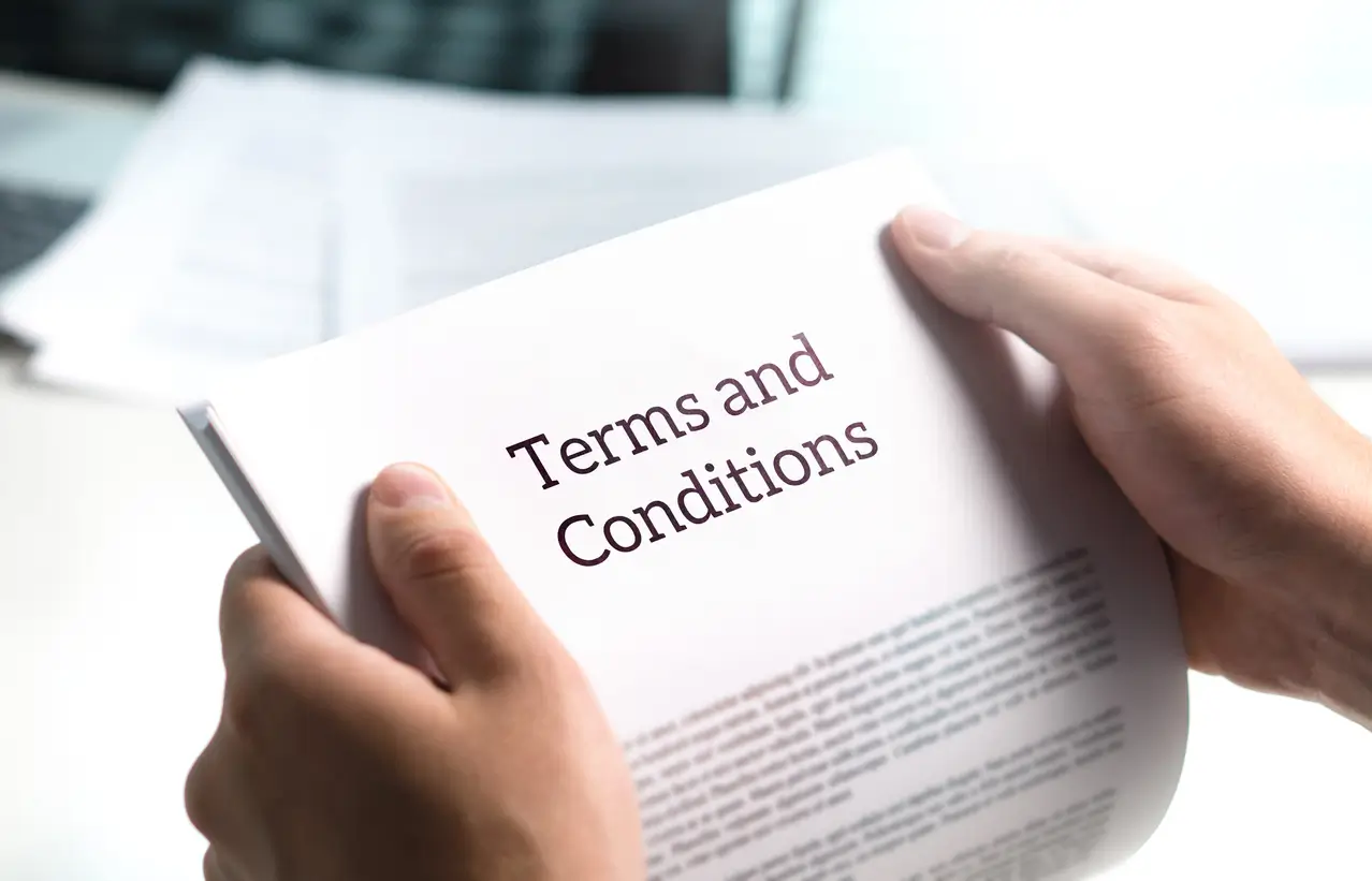 man holding terms and conditions document