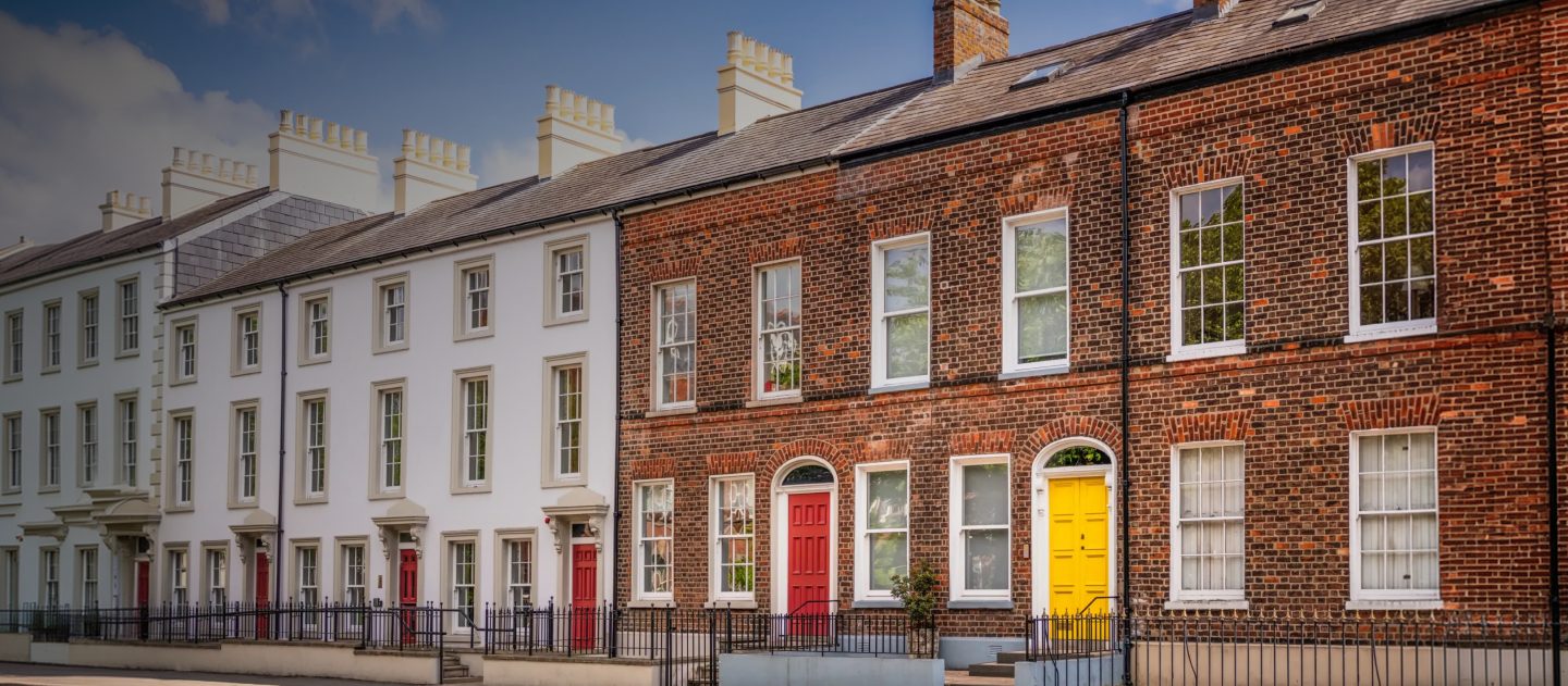 row of terrace houses with multi coloured doors