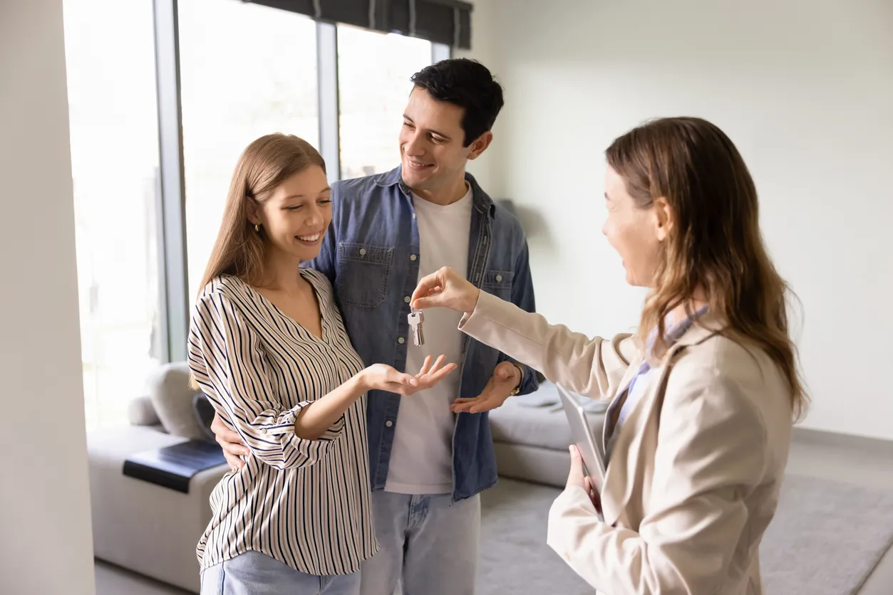 Couple buying a holiday home and exchanging keys