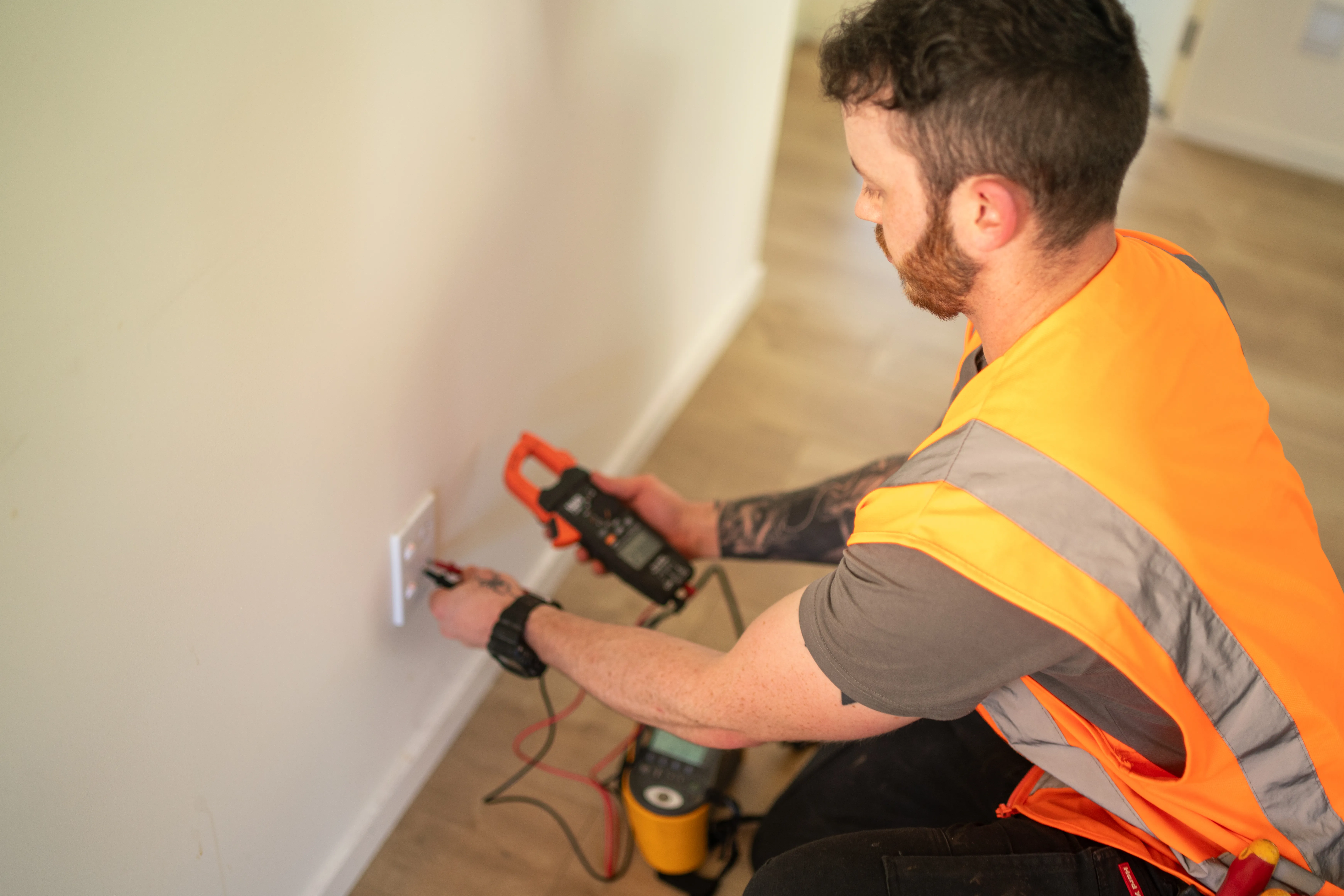 Electrician checking the electrics of a holiday home