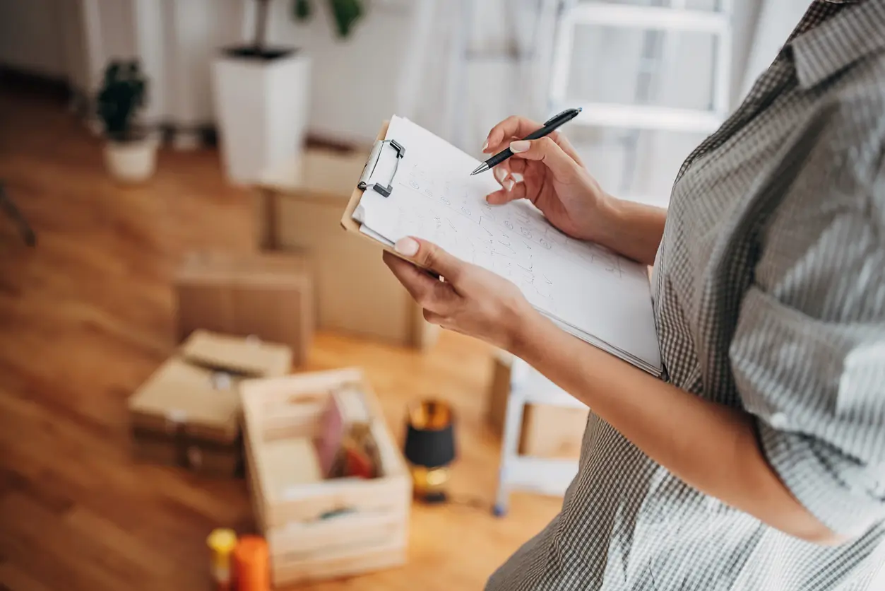 woman taking a house inventory