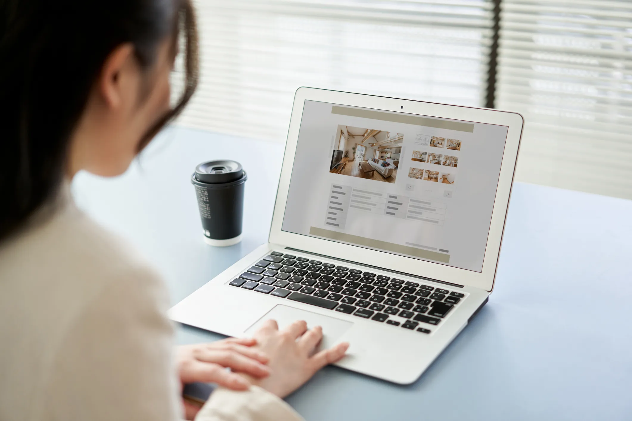 A woman looking at holiday properties online