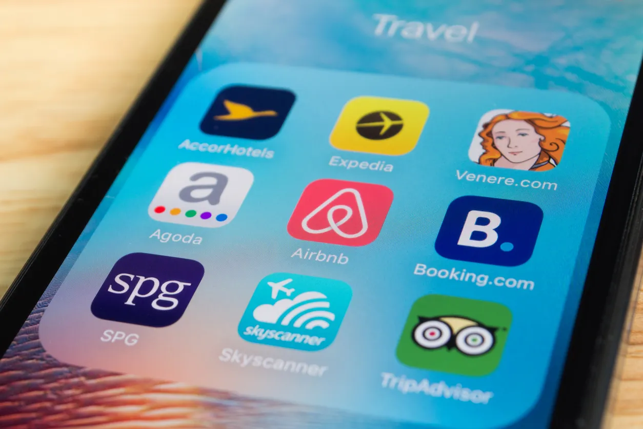 Phone showing holiday let booking apps such as Airbnb